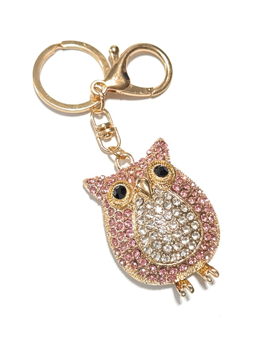Decorative owl keychain with pink and gold accents on a white background