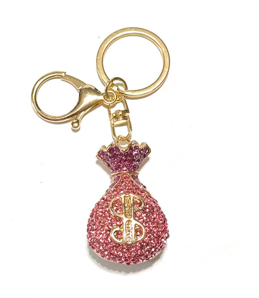 Keychain with pink and gold design on a white background