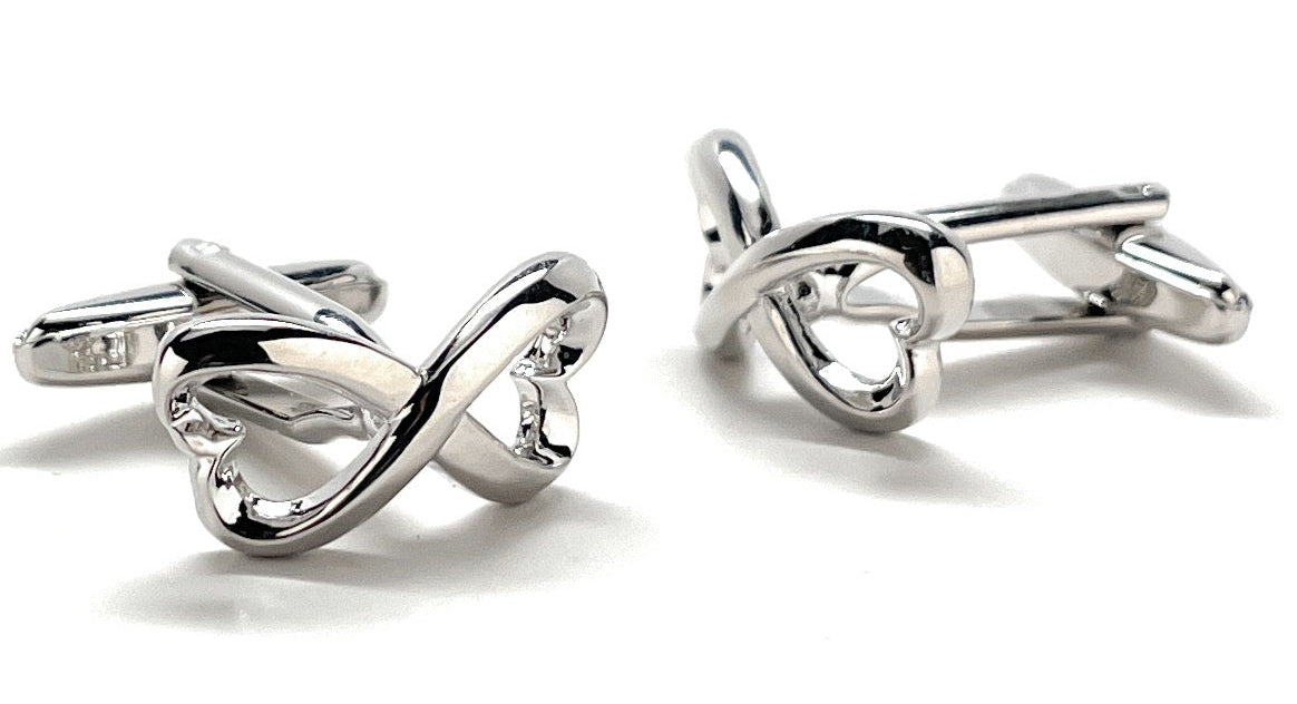 Silver infinity symbol cufflinks on a white background