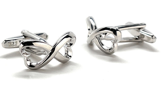 Silver infinity symbol cufflinks on a white background