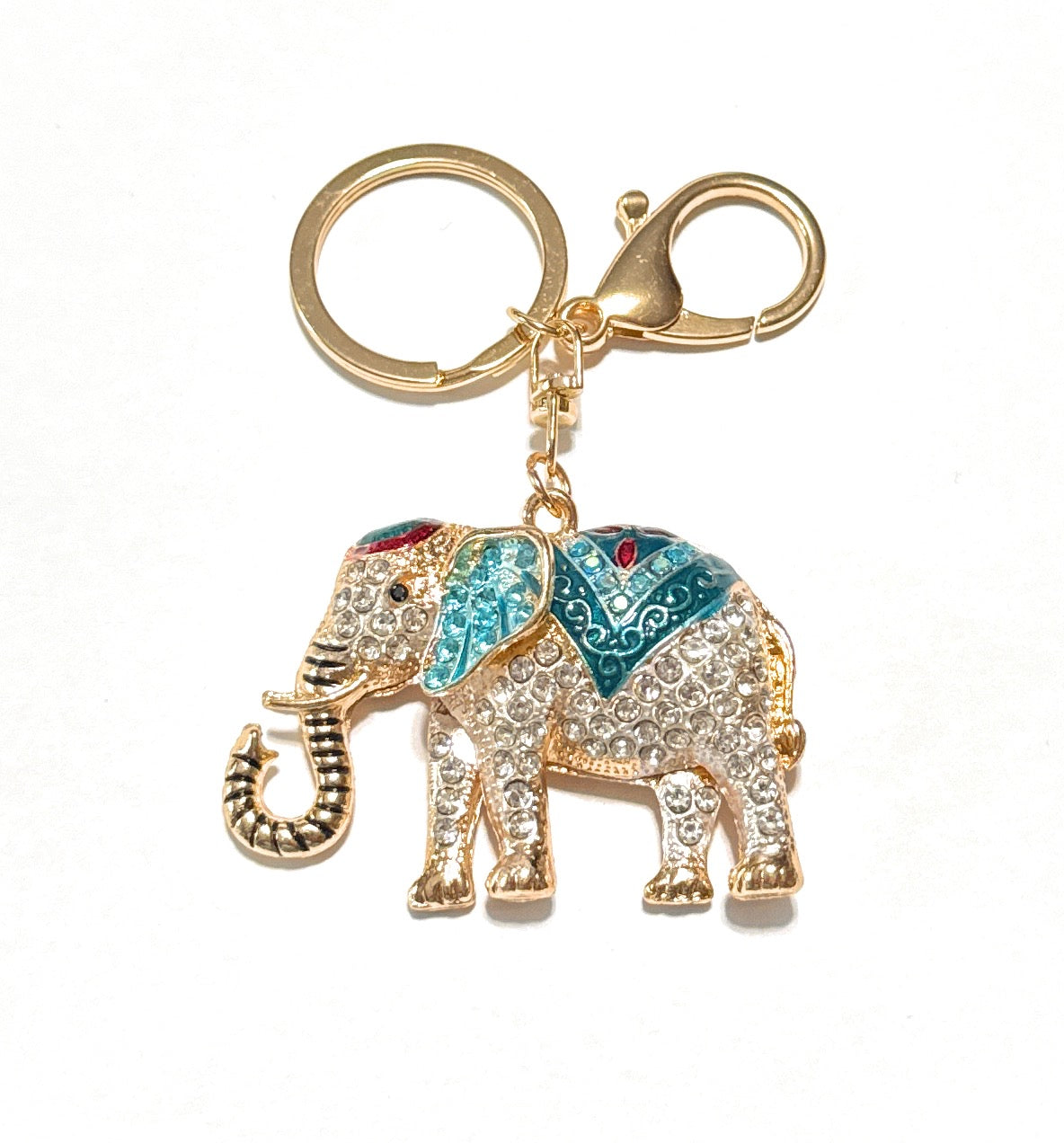 Decorative elephant keychain with gemstones on a white background