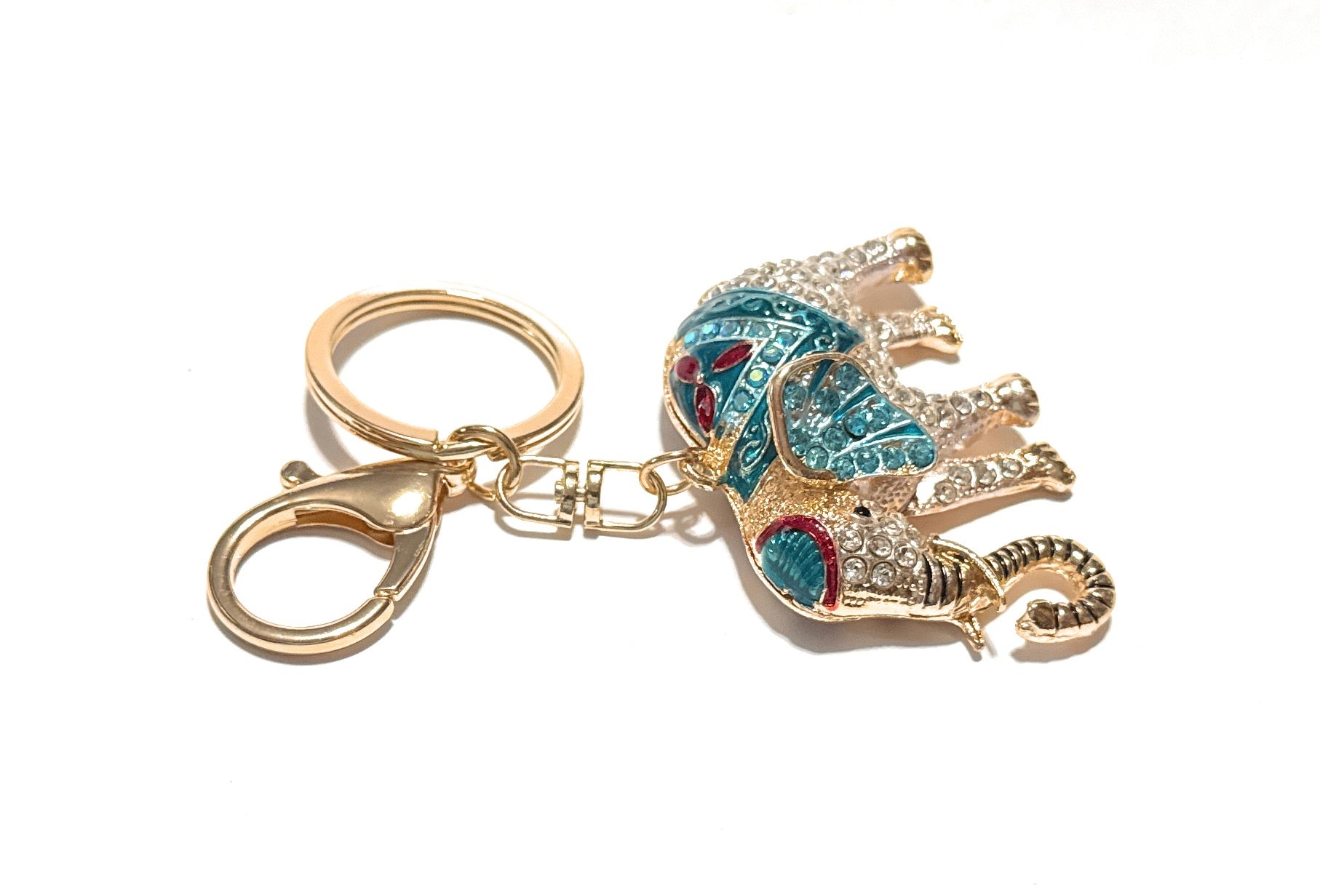 Decorative elephant keychain with colorful design on a white background