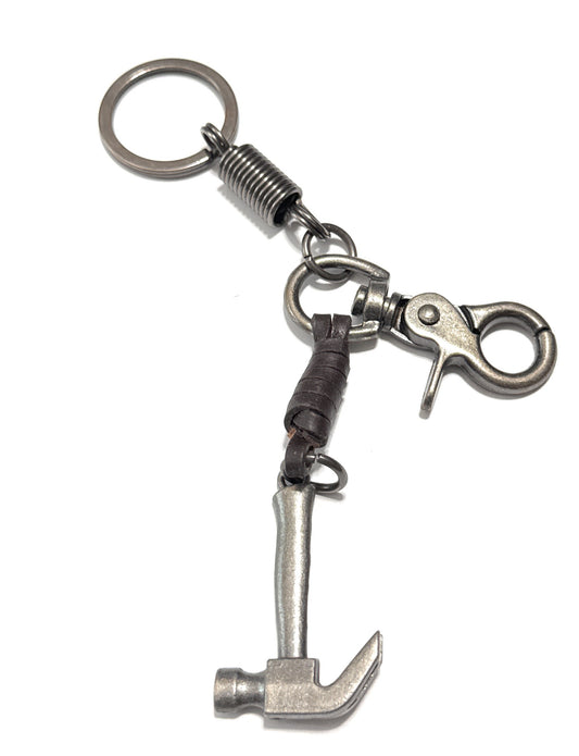 Metal keychain with a hammer design on a white background