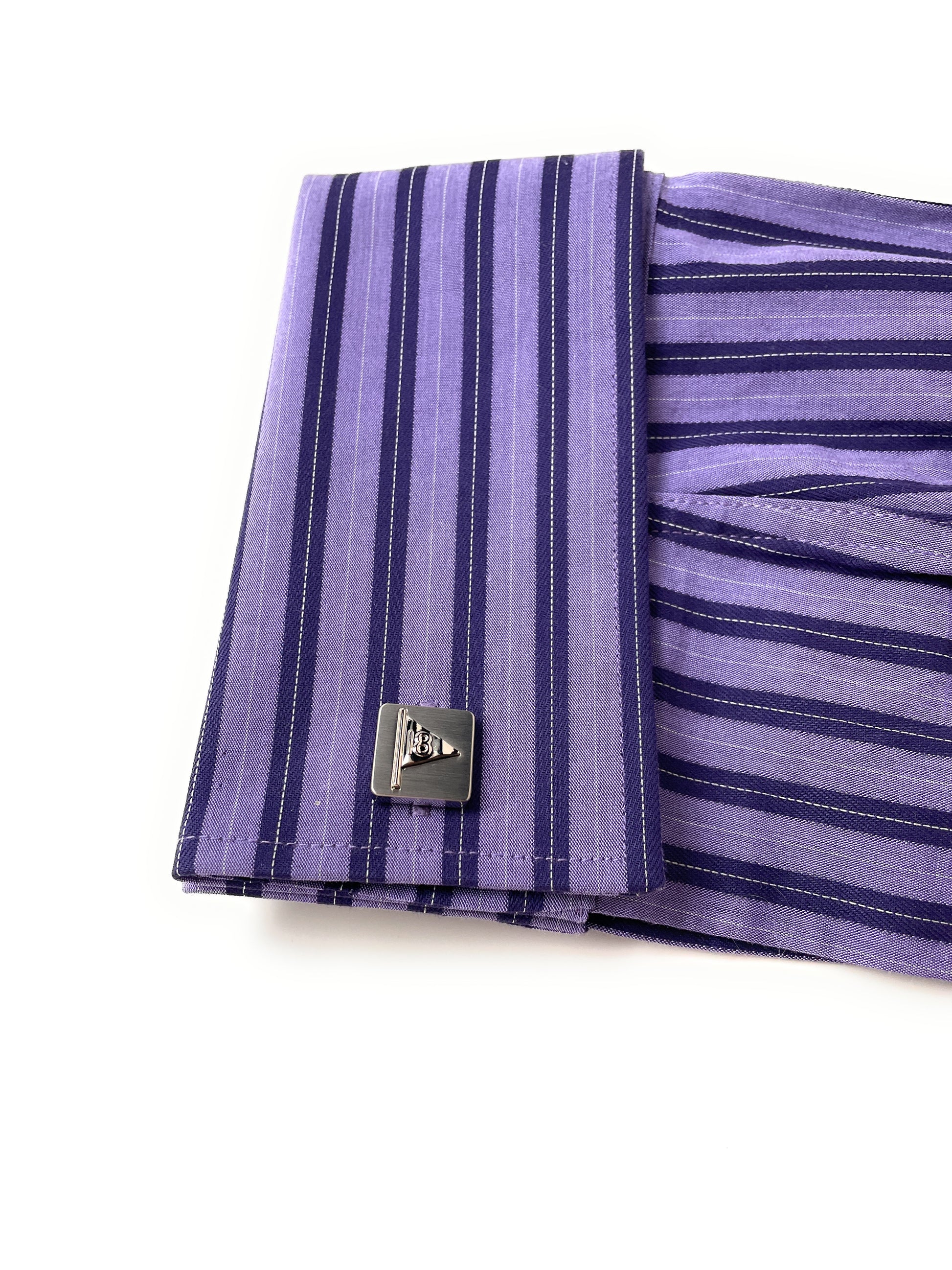 Purple striped shirt with cufflinks on a white background