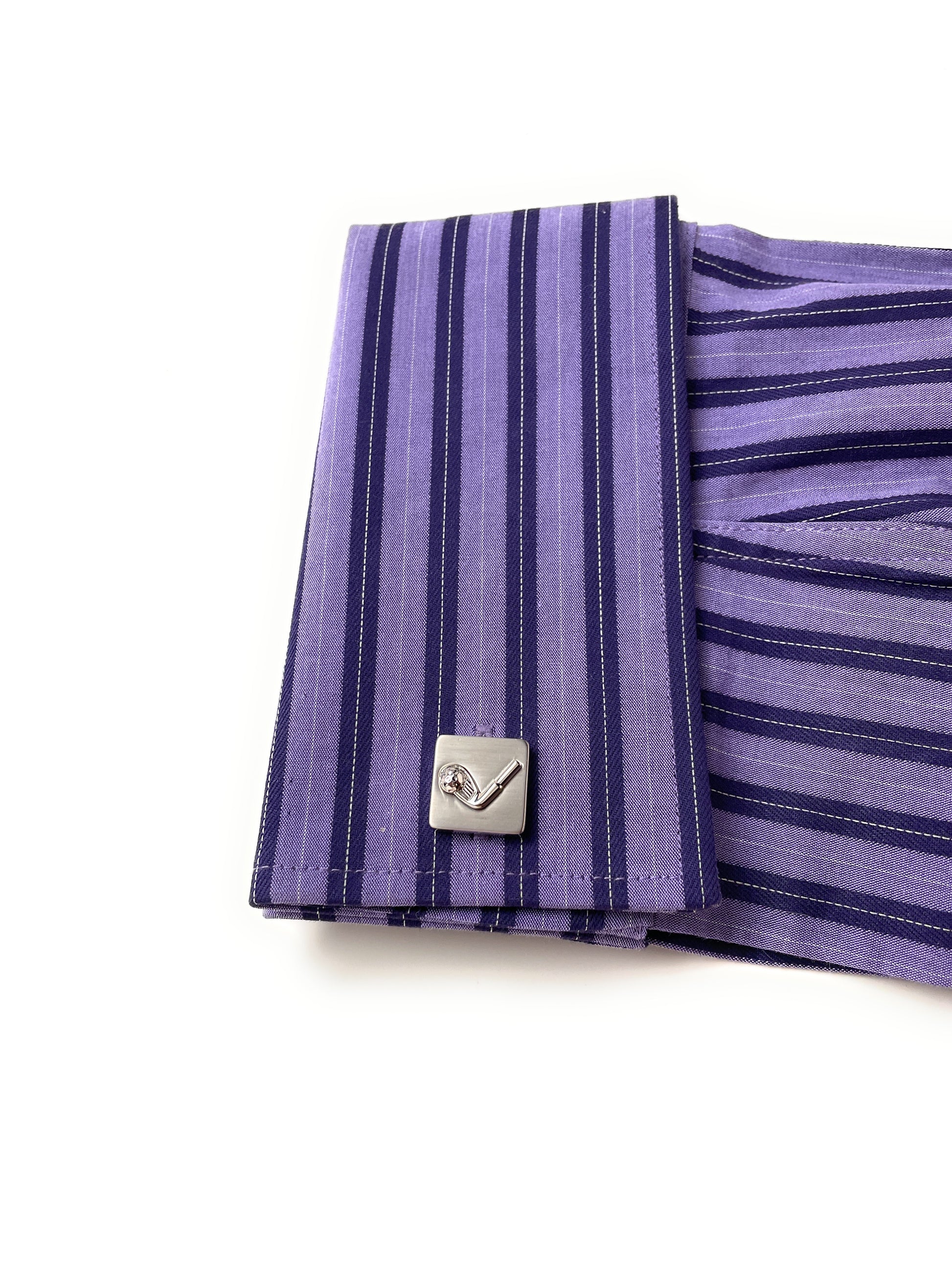 Purple striped fabric with a metal clasp on a white background