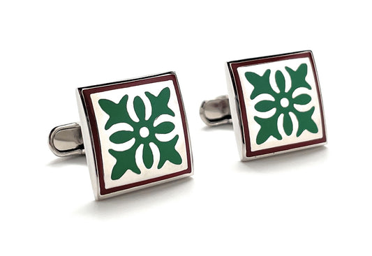 Square cufflinks with green floral design on a white background