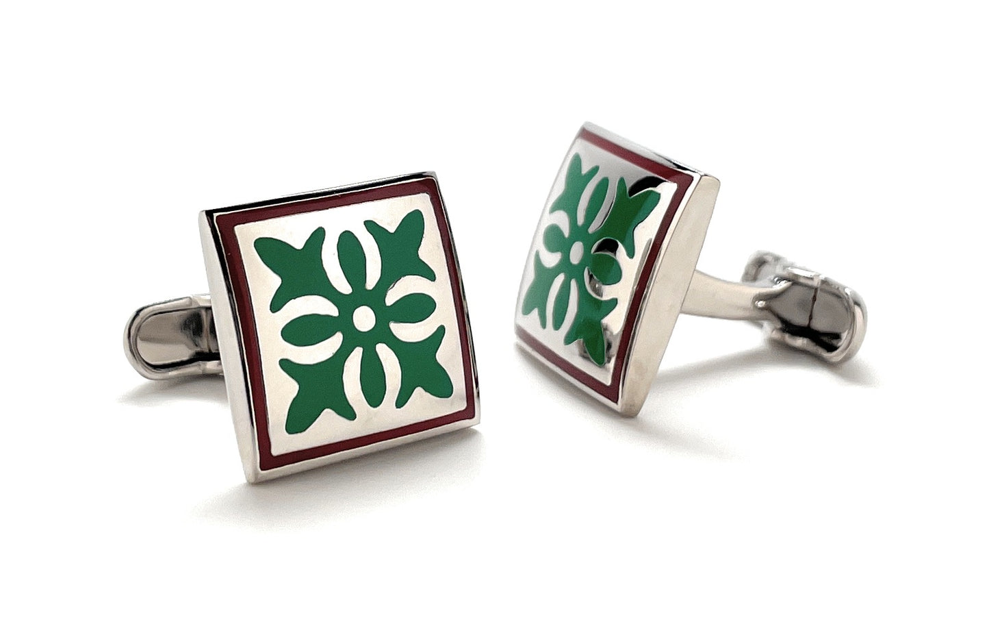 Square cufflinks with green floral design on a white background
