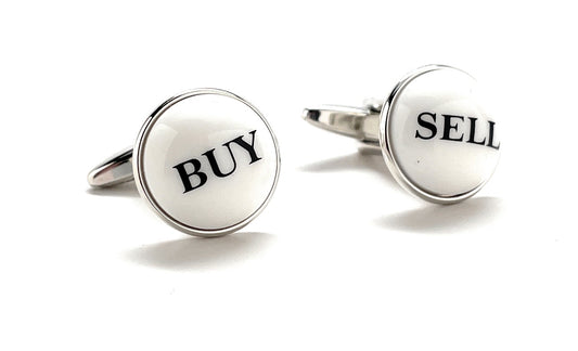 Cufflinks with 'BUY' and 'SELL' text on a white background