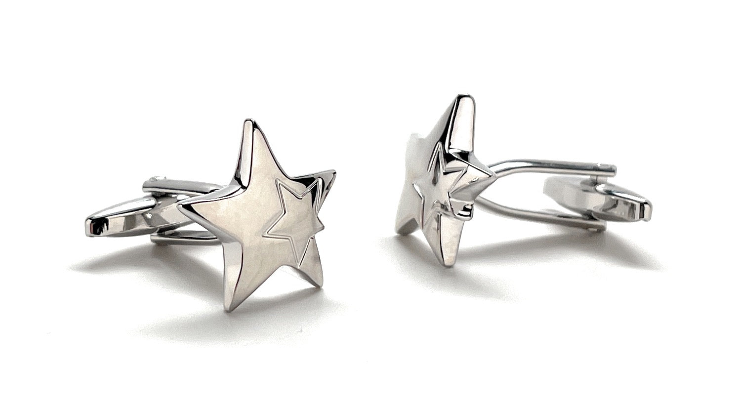 Star-shaped cufflinks on a white background