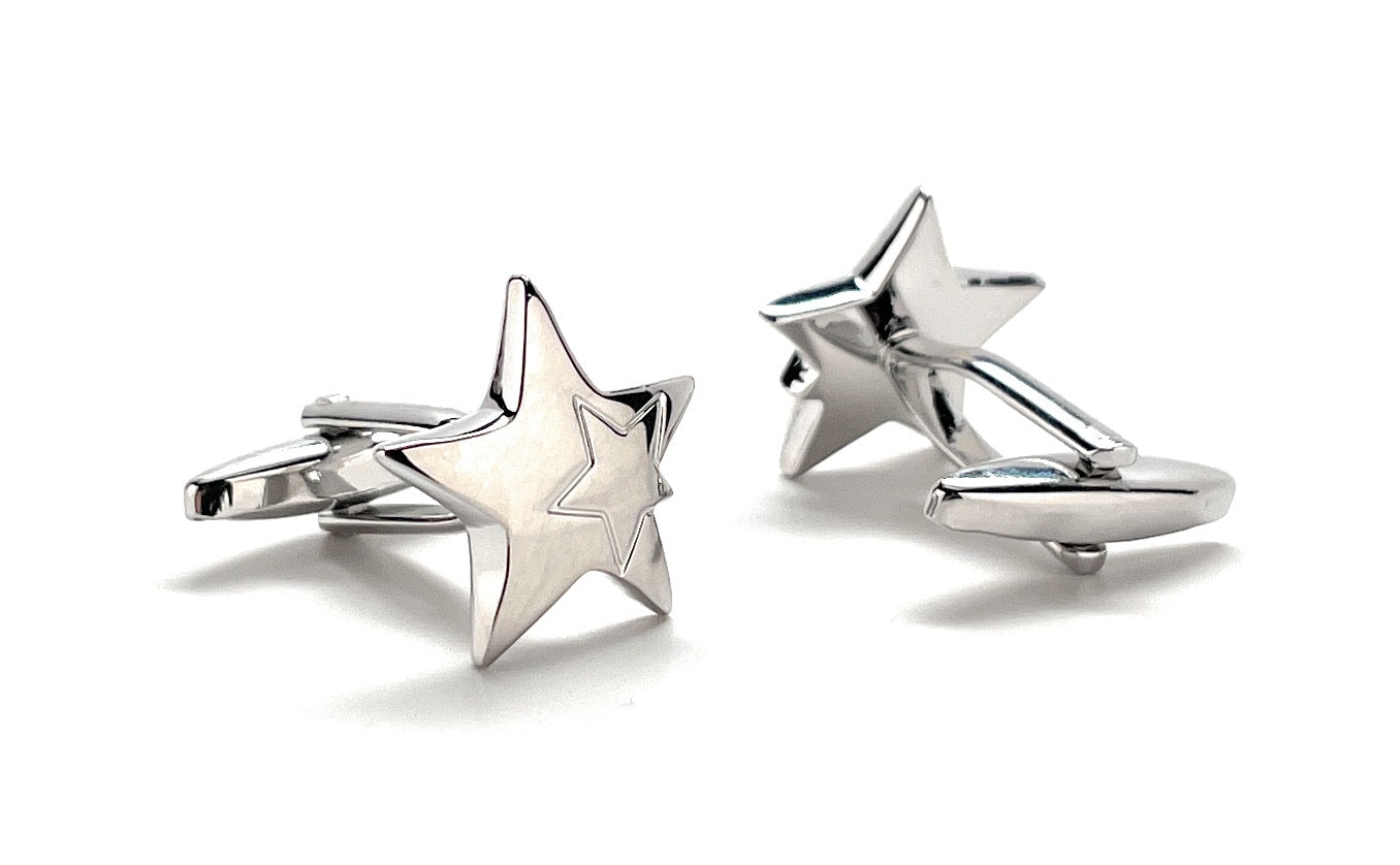 Star-shaped silver cufflinks on a white background