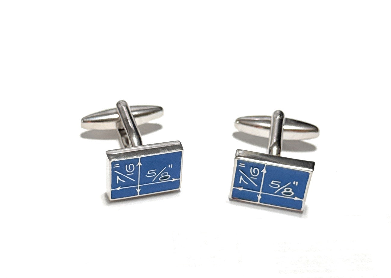 Pair of cufflinks with blue design on a white background