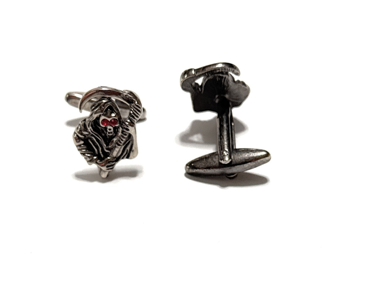 Silver dog-shaped cufflinks on a white background