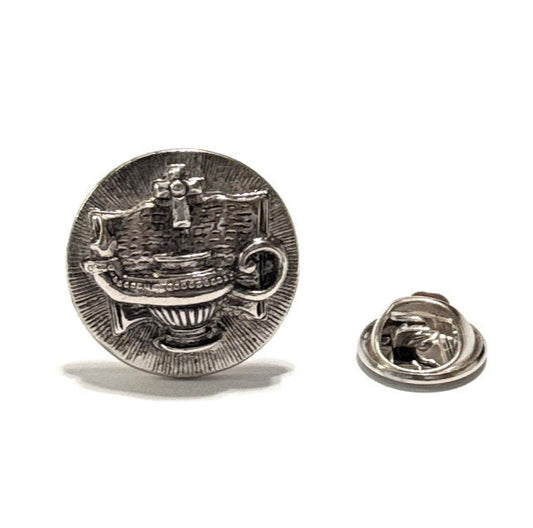 Silver badge with a design on a white background