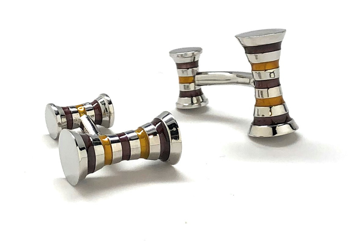 Set of silver and multicolored striped cufflinks on a white background
