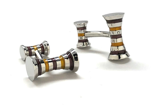 Set of silver and multicolored striped cufflinks on a white background