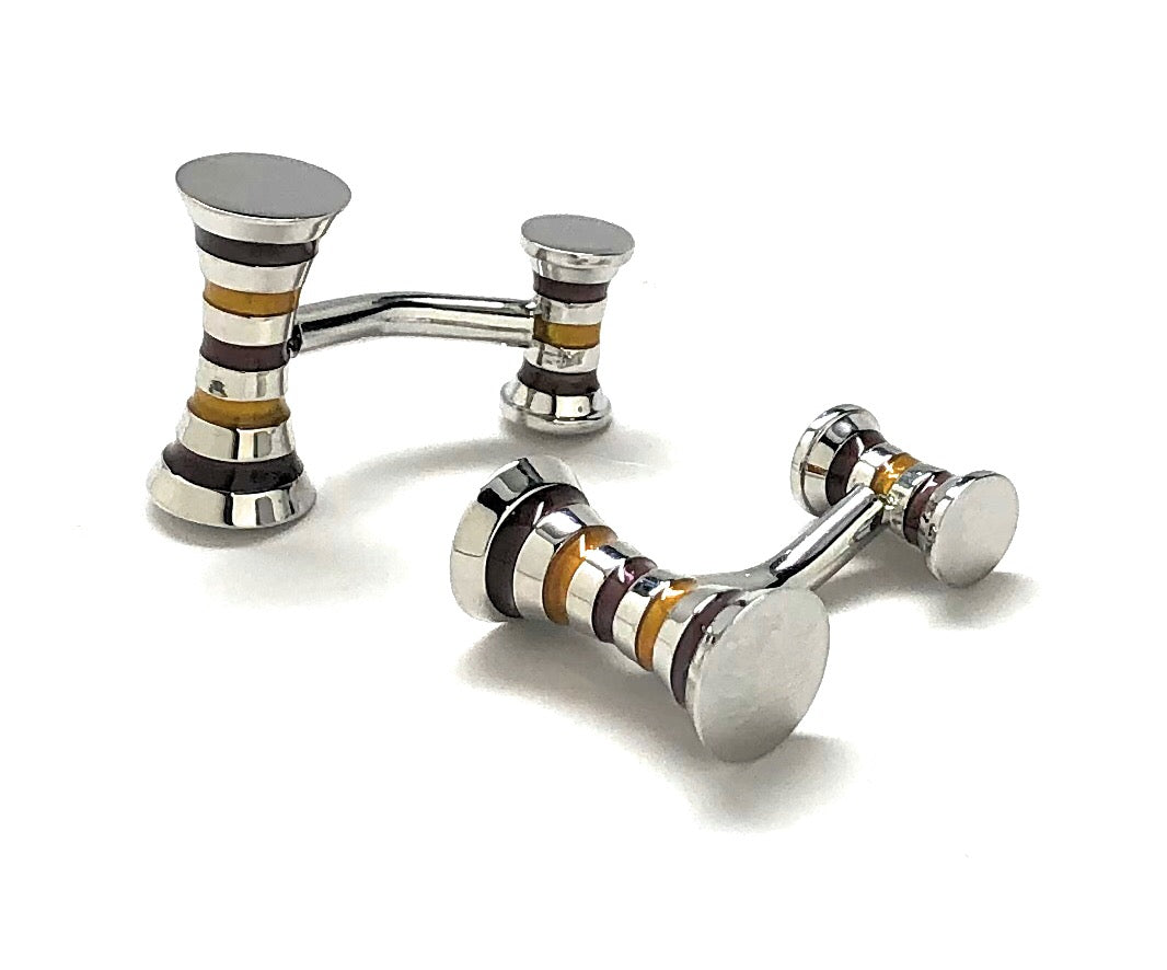 Silver cufflinks with striped design on a white background