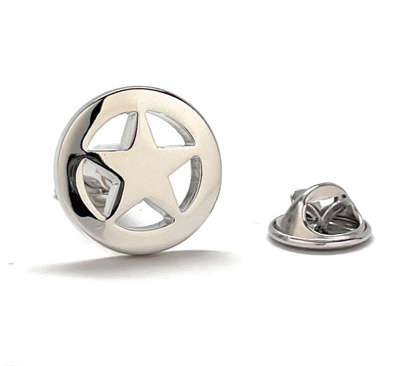 Silver star-shaped lapel pin on a white background