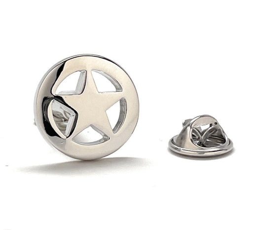 Silver star-shaped lapel pin on a white background