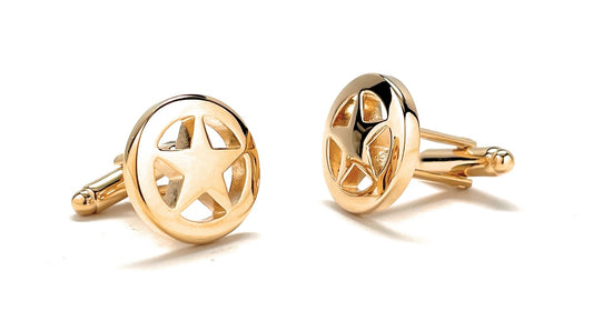 Pair of gold star-shaped cufflinks on a white background