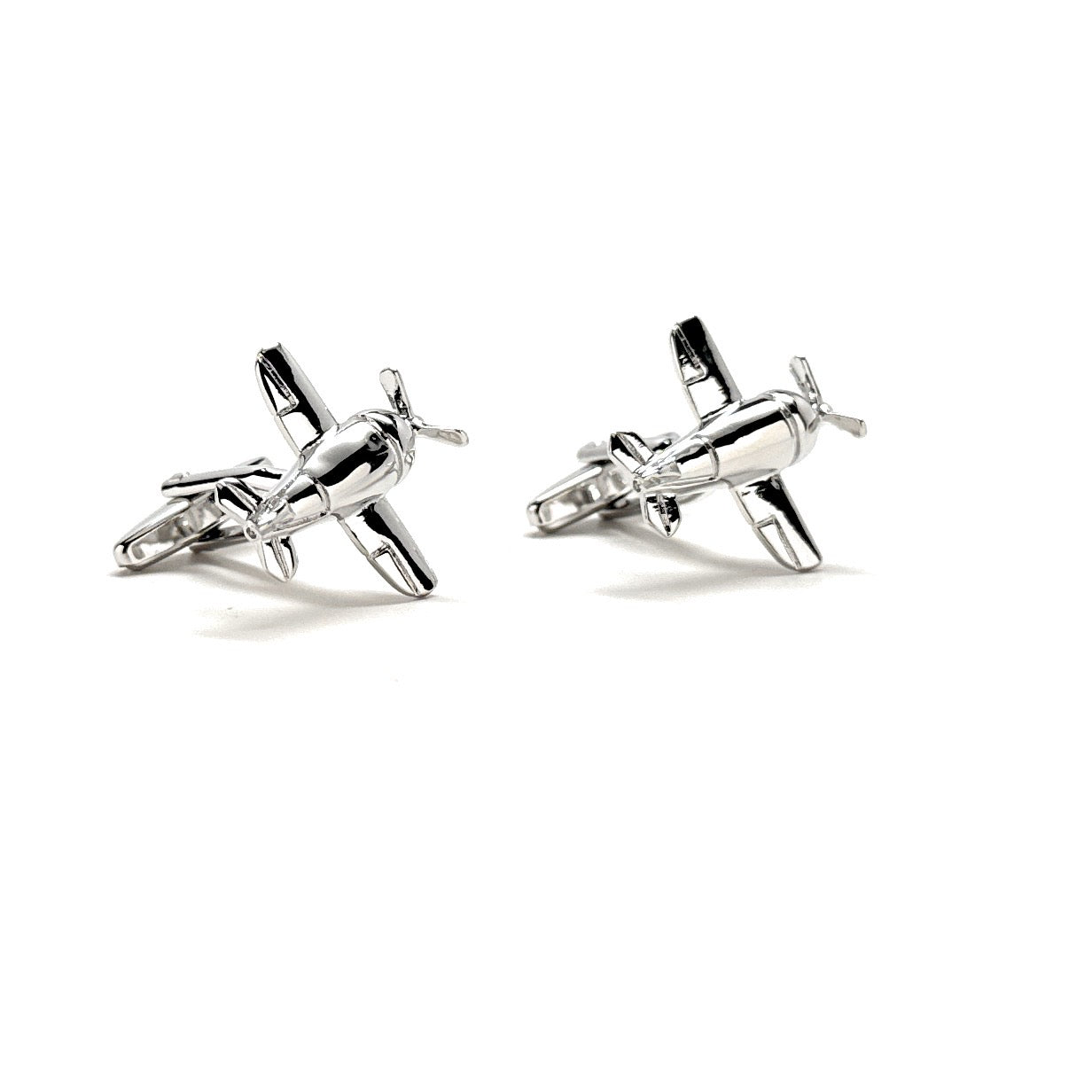 Silver airplane-shaped cufflinks on a white background