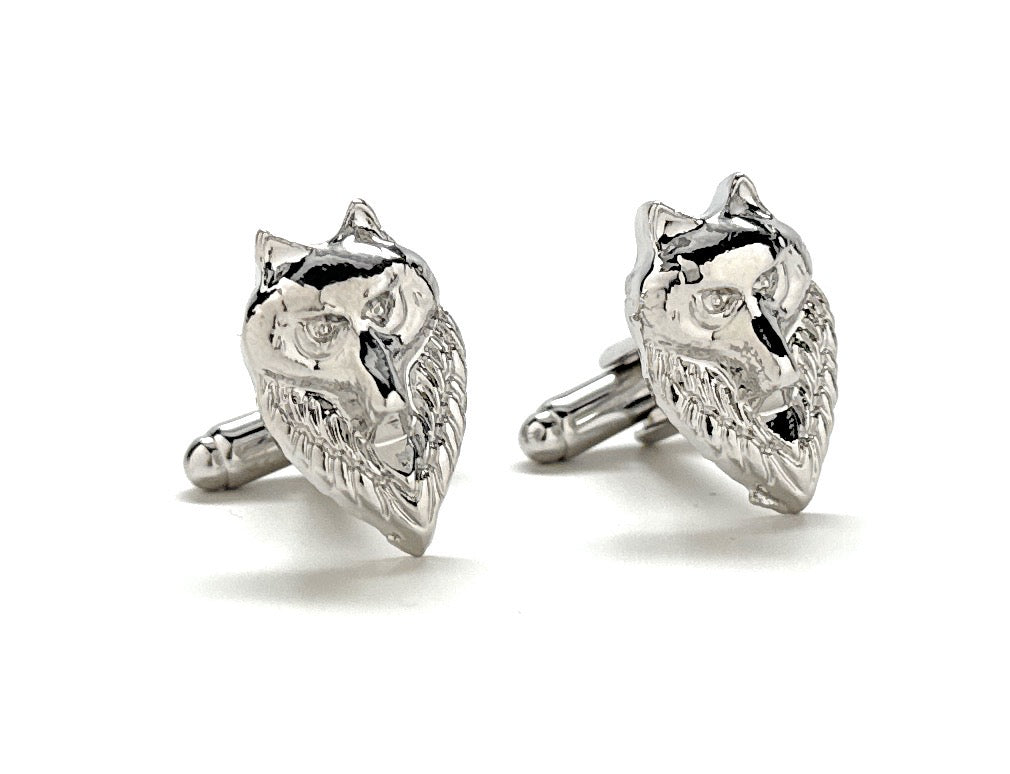 Silver wolf-shaped cufflinks on a white background