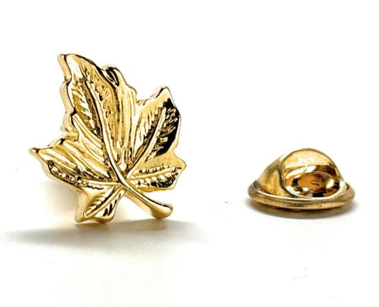Gold leaf-shaped lapel pin on a white background