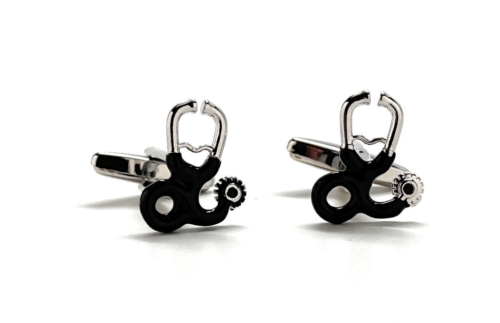 Black and silver cufflinks with a unique design on a white background