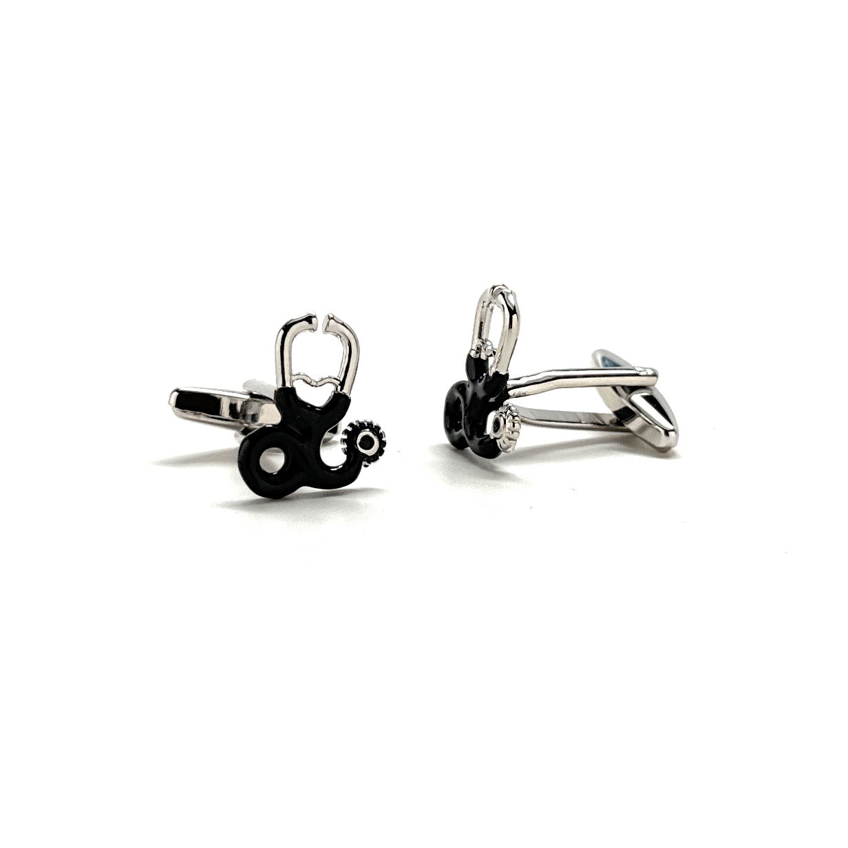 Pair of silver and black cufflinks on a white background