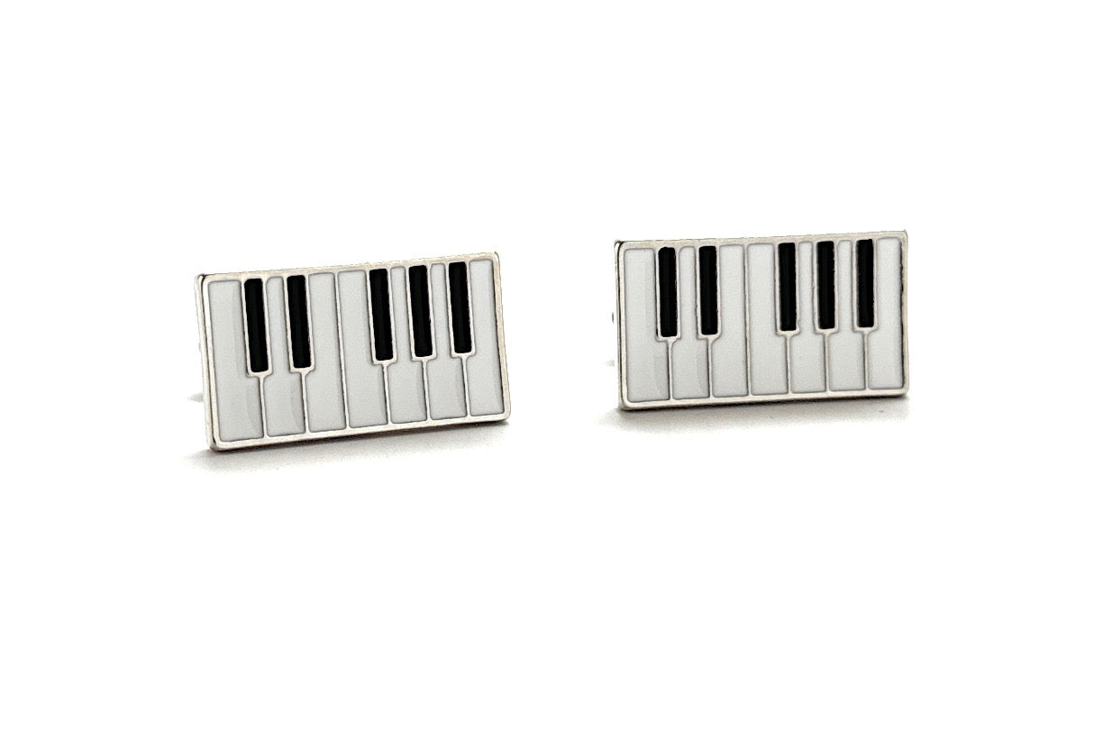 Piano key design cufflinks on a white background