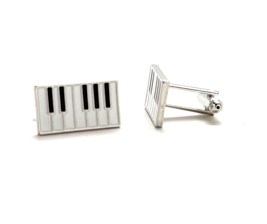 Piano key design cufflinks on a white background