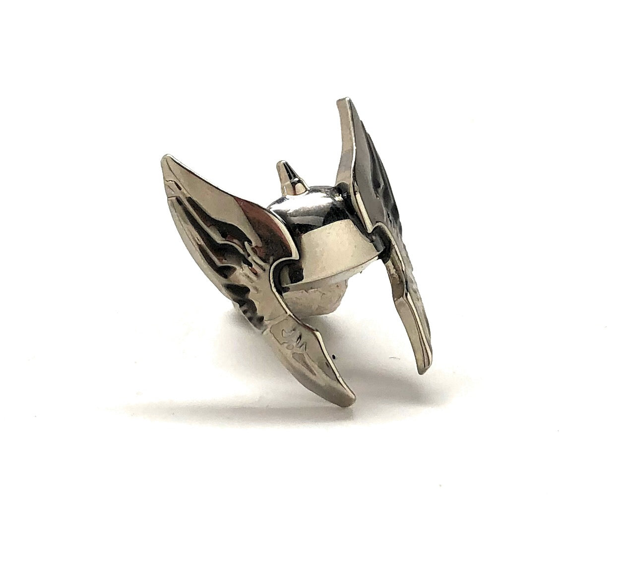 Metallic bow nock stopper on a white background