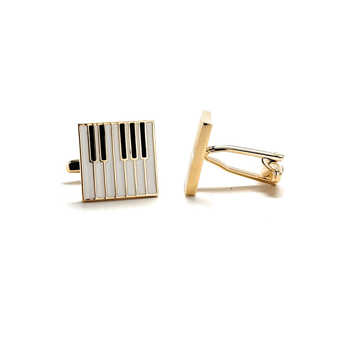 Gold and black striped cufflinks on a white background