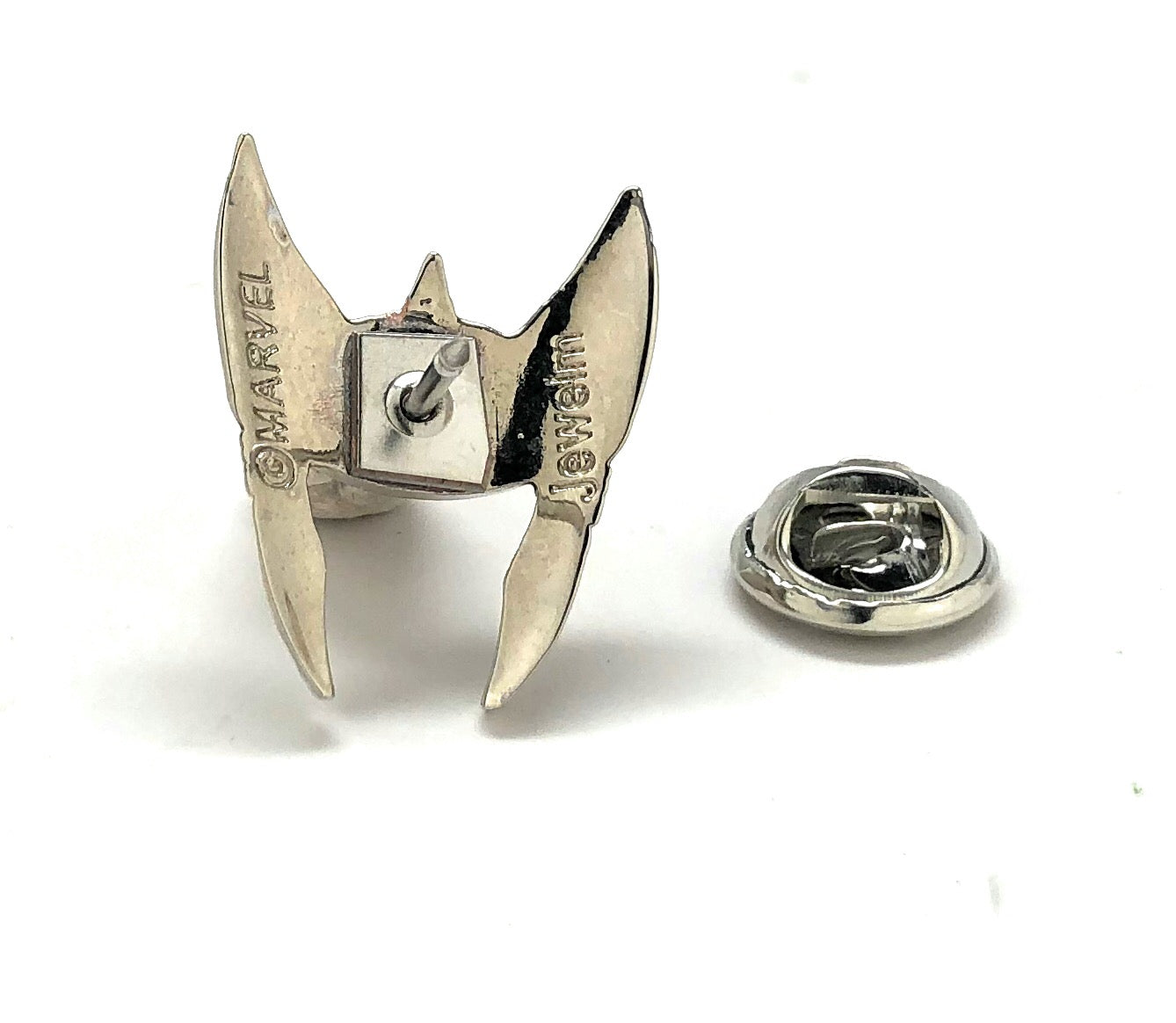 Metallic Marvel logo pin on a white background