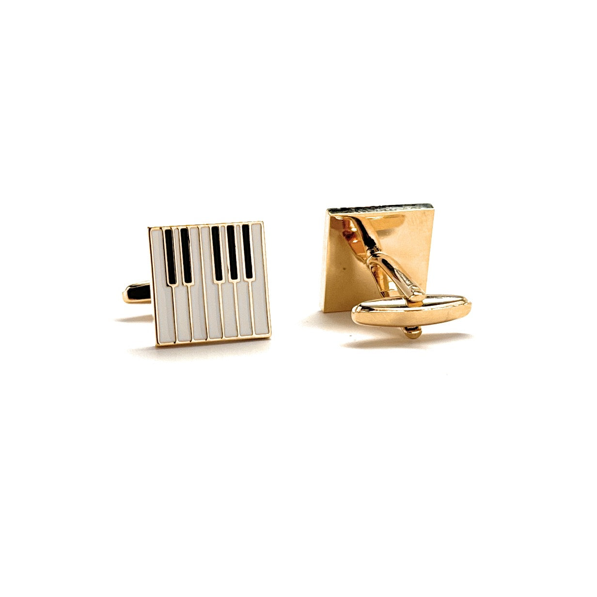 Two gold cufflinks with different designs on a white background