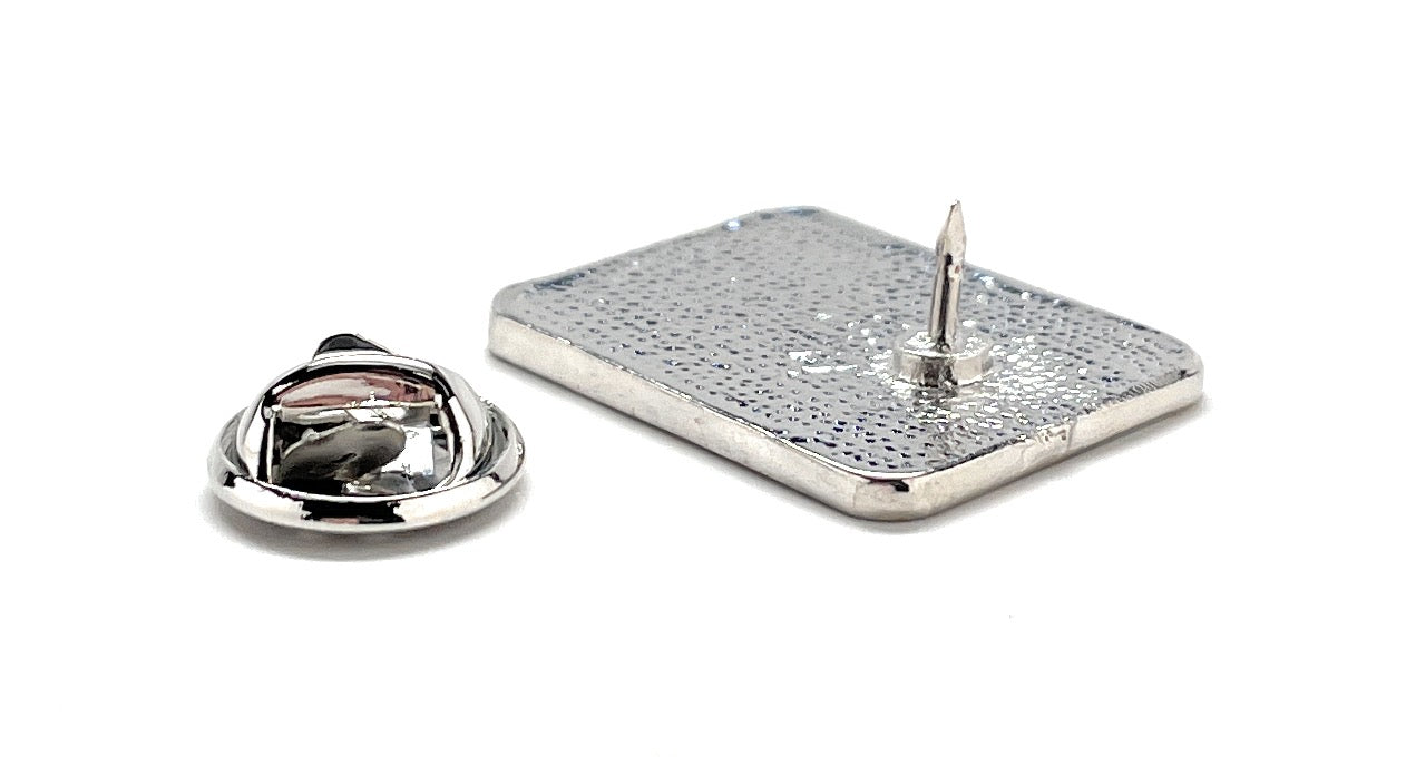 Silver jewelry piece with a rectangular base and circular top on a white background