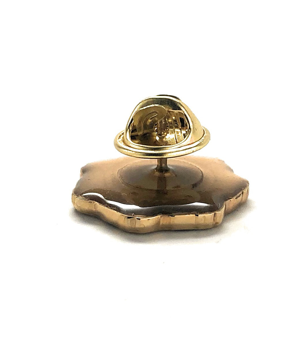 Gold decorative object on a white background