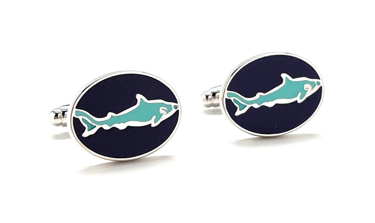 Shark-themed cufflinks with blue shark design on a navy background