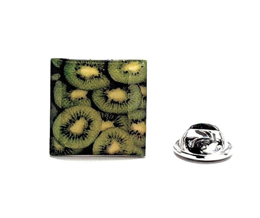 Kiwi patterned square pin with a metal clasp on a white background