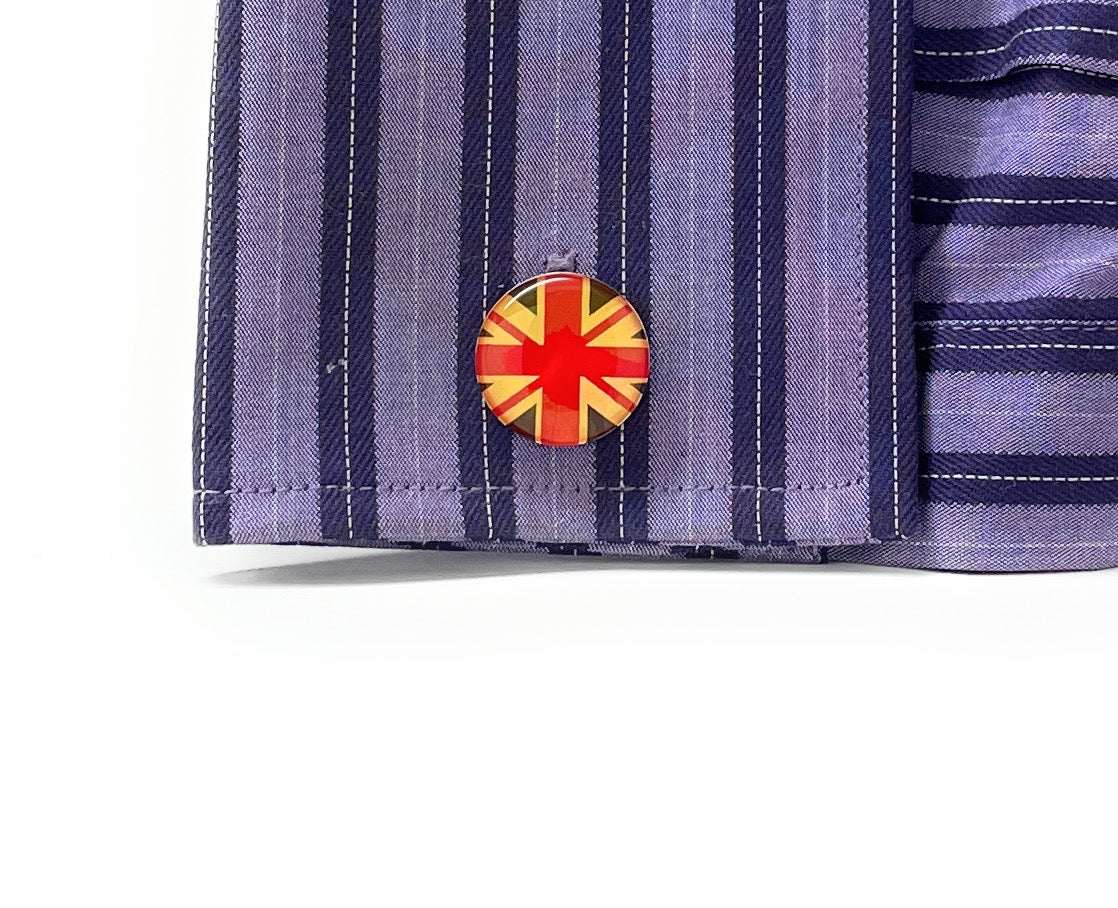 Round United Kingdom flag cufflinks with glossy red, cream and navy enamel design and silver bullet-back closure.