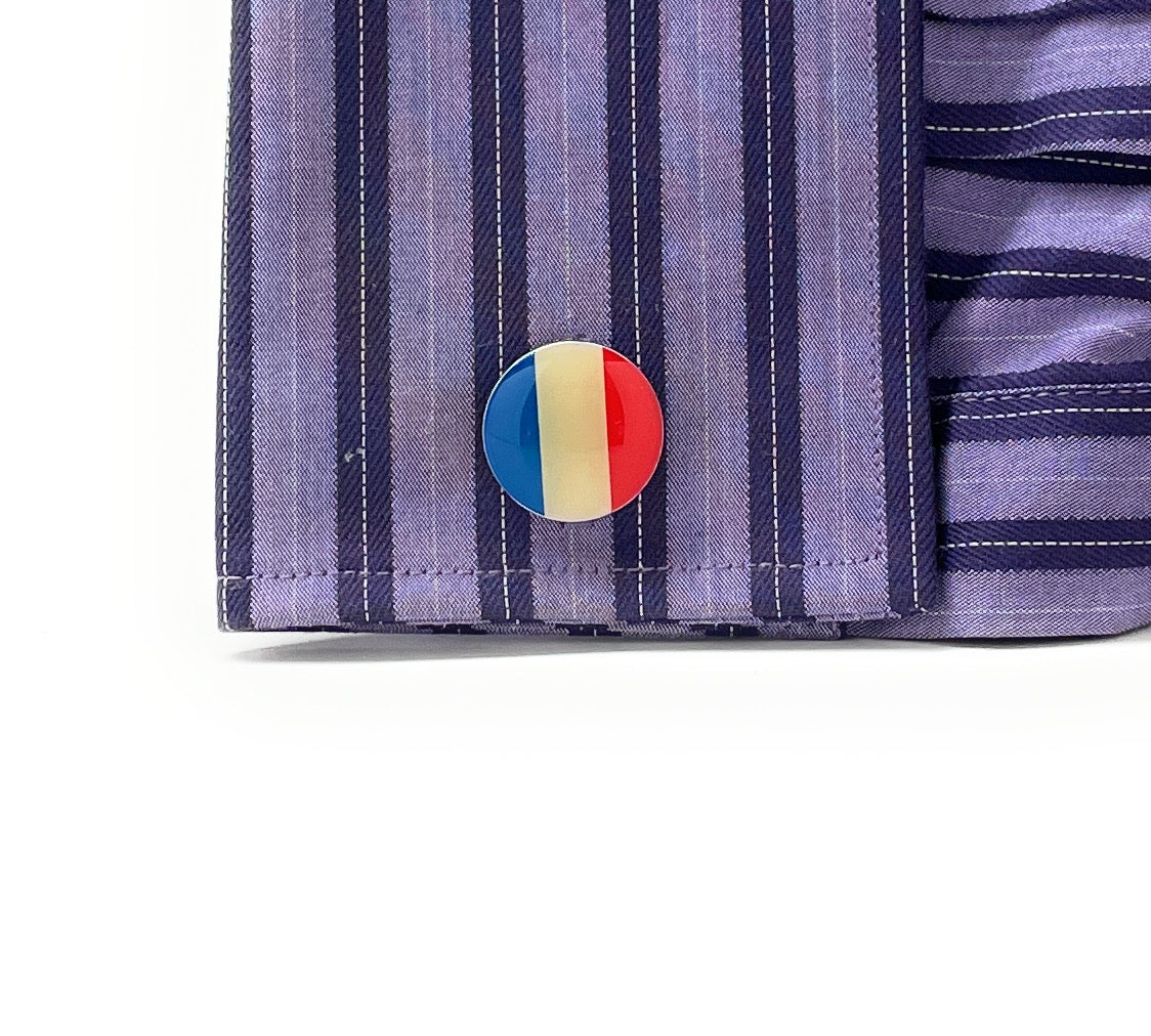 Round France flag cufflinks with glossy blue, white, and red enamel design and silver bullet-back closure.