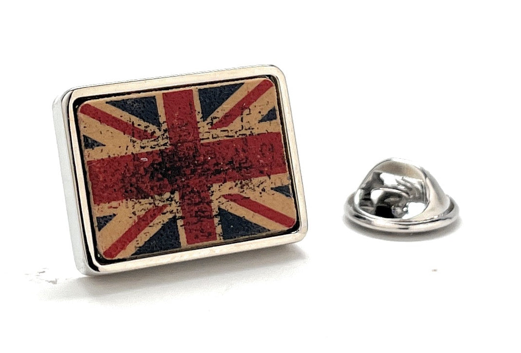 Rectangular vintage-style Union Jack lapel pin with a distressed red, white, and blue enamel design and silver trim, ideal for British pride or collector’s gifts.