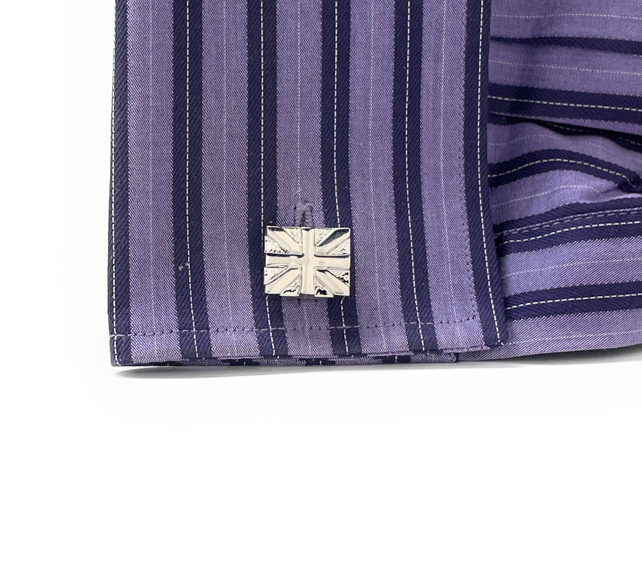 Polished silver Union Jack cufflinks with embossed British flag design and bullet-back closures, perfect for formal wear or patriotic gifts.