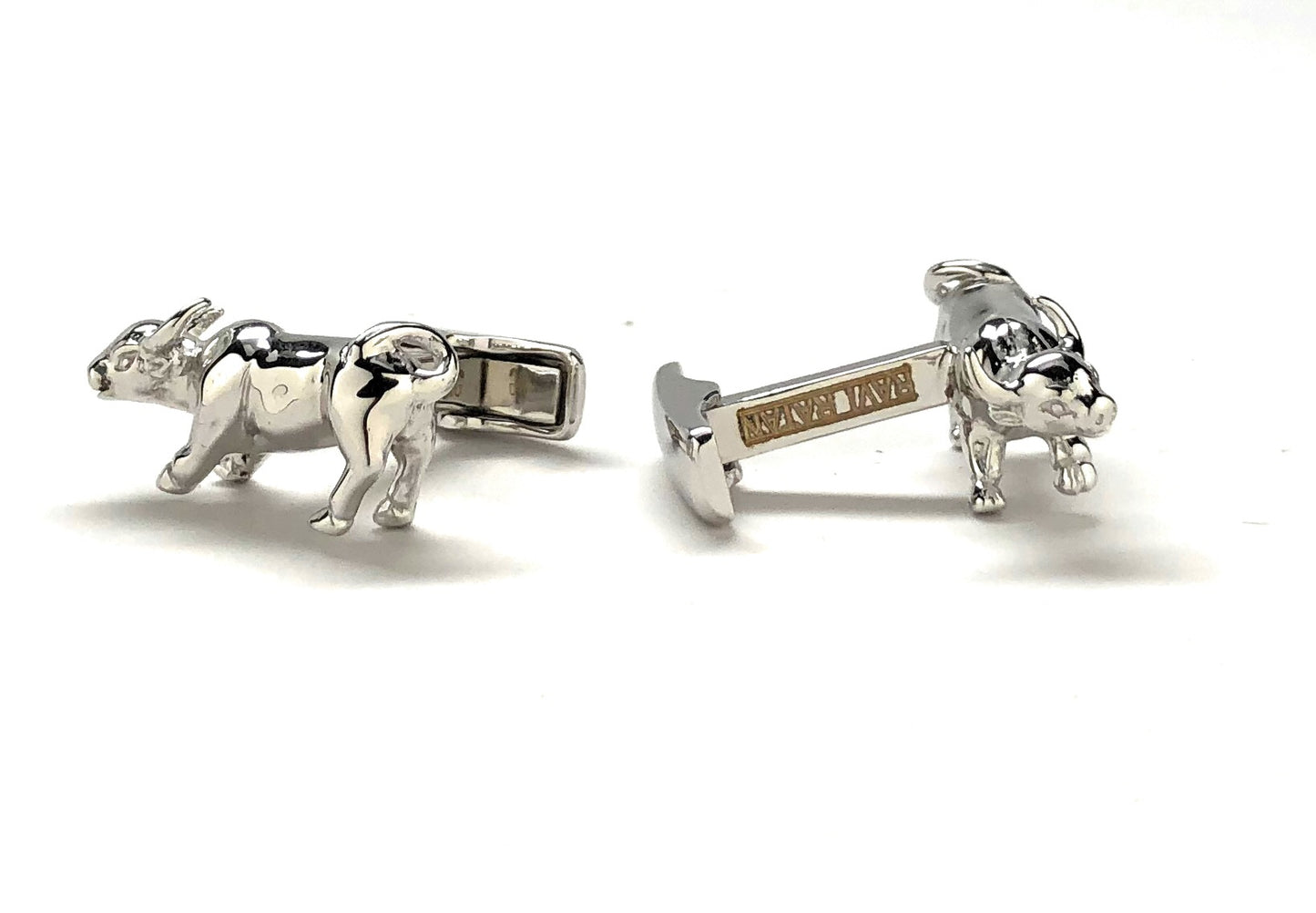 Silver bull cufflinks on a white background