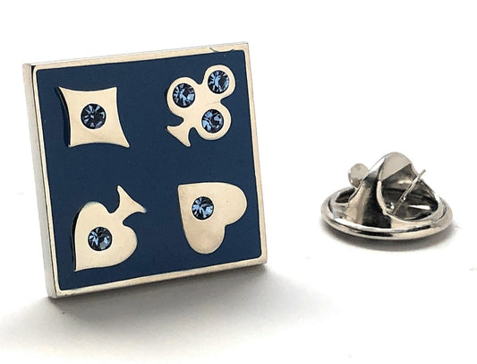 Square pin with card suit symbols on a blue background