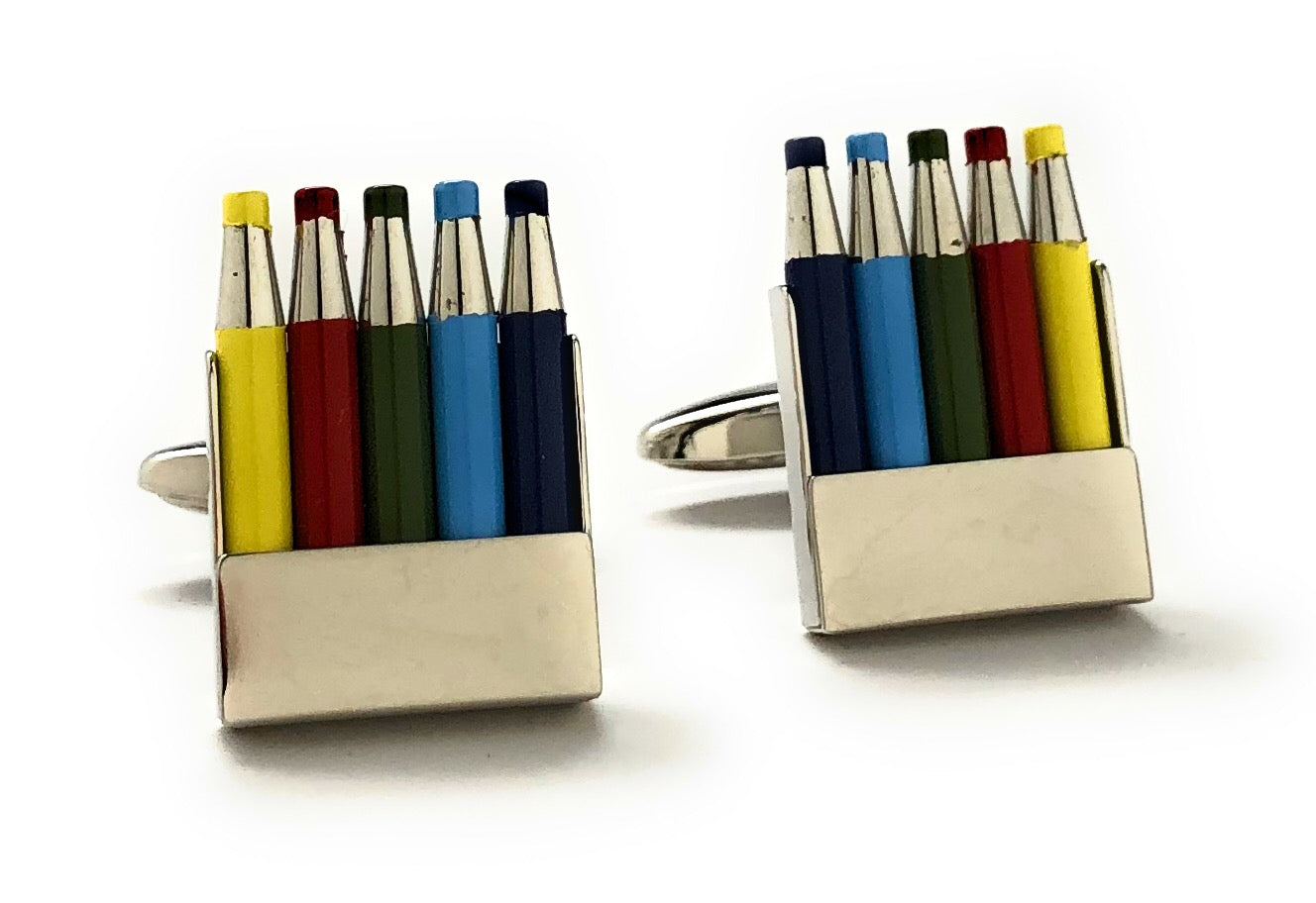 Colorful pen-shaped cufflinks on a white background