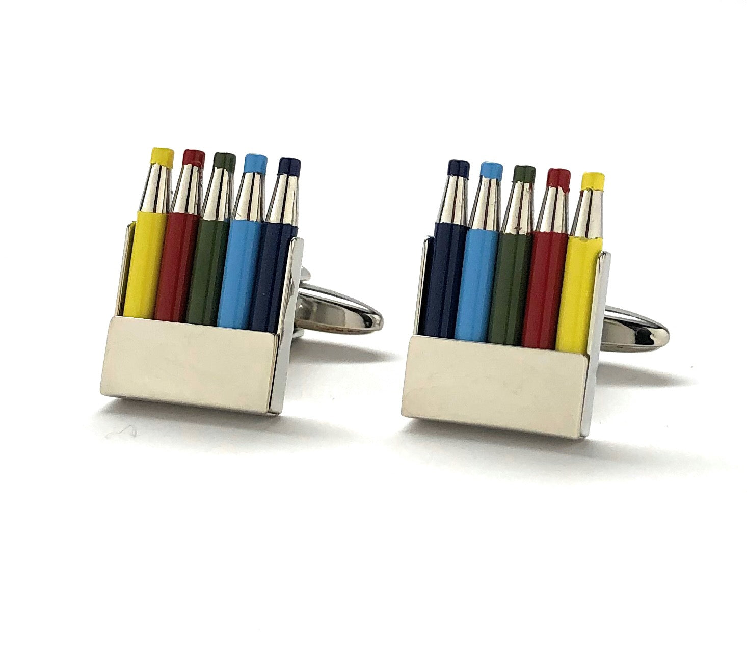 Colorful pen-shaped cufflinks on a white background