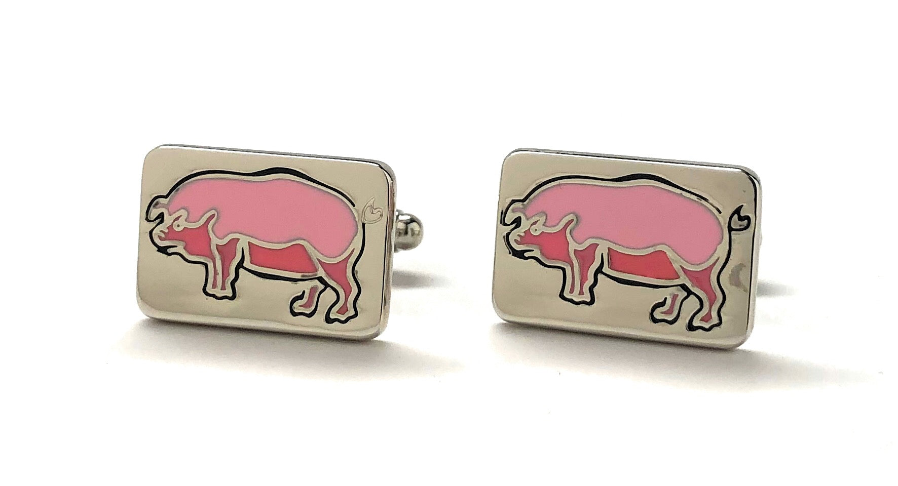 Pink pig cufflinks on a white background