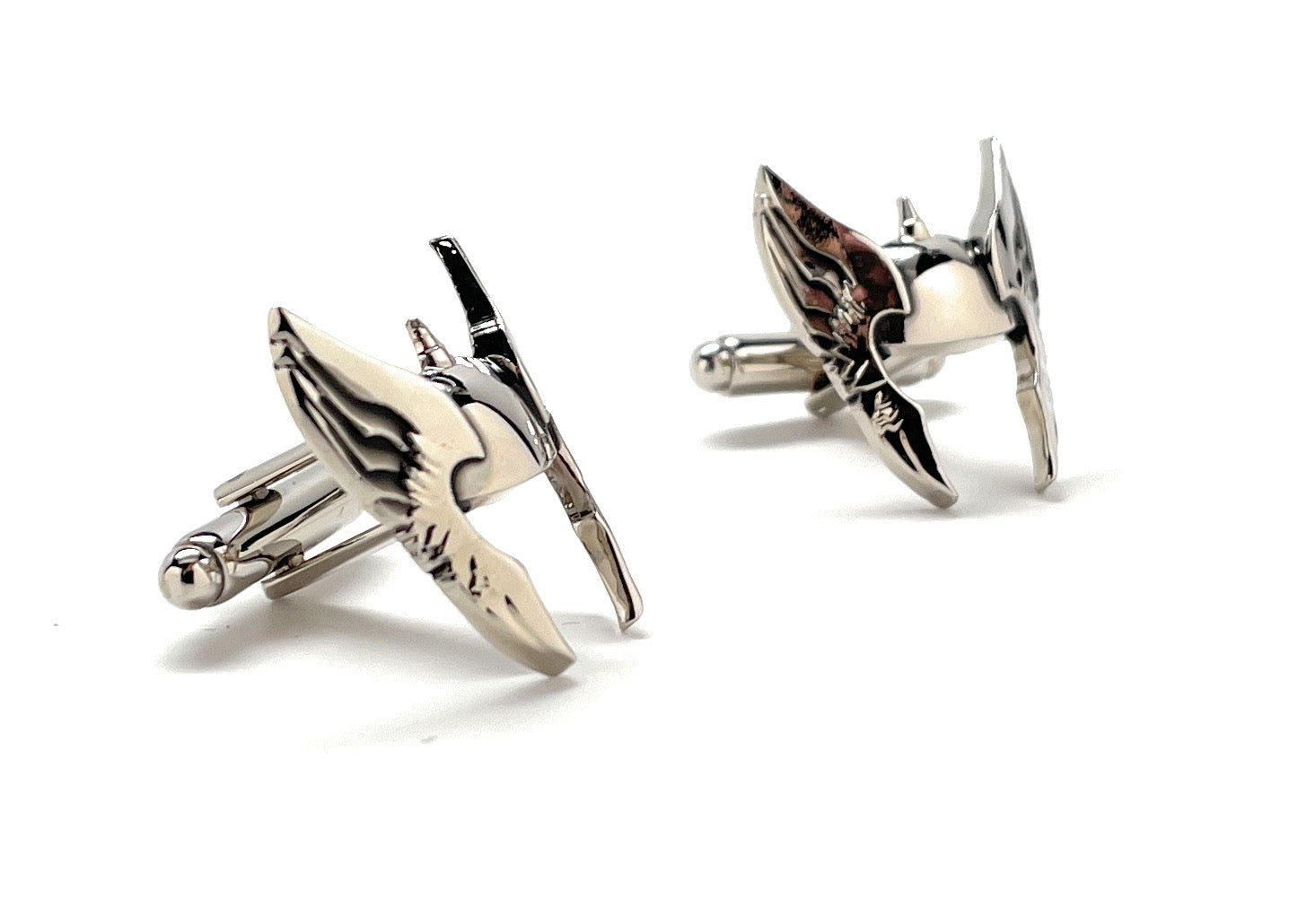 Pair of silver star-shaped cufflinks on a white background