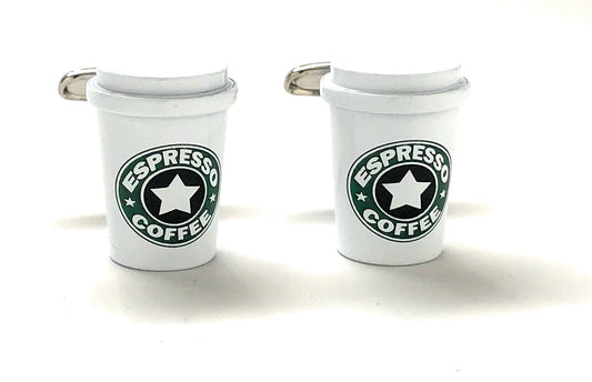 Two white cup-shaped cufflinks with 'Espresso Coffee' text and star design on a white background
