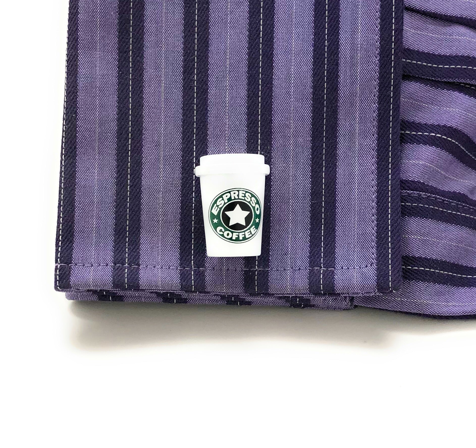 Striped fabric with a Starbucks logo on a white background